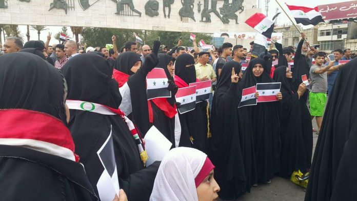مظاهرات حاشدة في بغداد تنديداً بالعدوان الثلاثي على سوريا