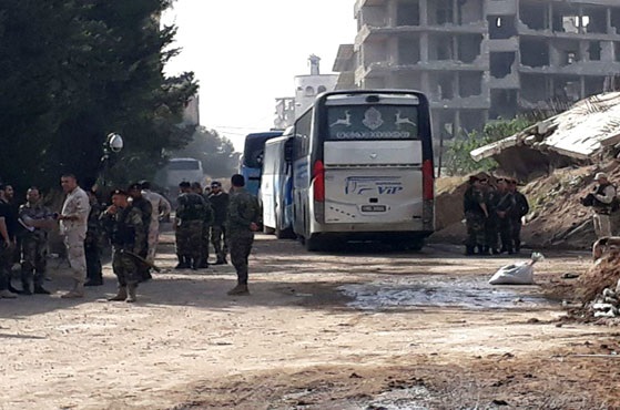 بدء إخراج المجموعات الإرهابية من ريفي حمص وحماة نحو الشمال السوري