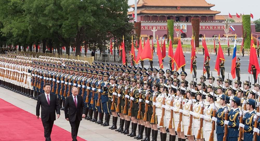 الرئيسان الروسي الصيني يؤكدان على وحدة سوريا وضرورة البدء بإعادة إعمارها