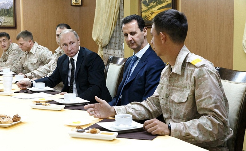 Putin Pays Surprise Visit to Syria, Orders Forces Withdrawal