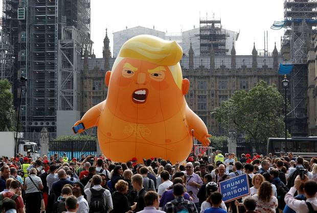 Trump Visits UK, Avoids London Due to Massive Protests